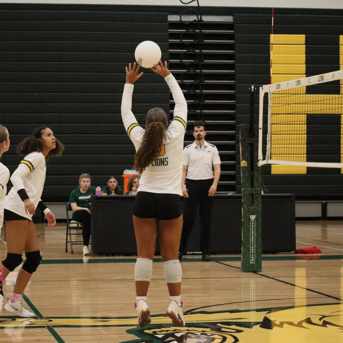 Sophomore Jada Green sets the ball for her teammate Hazel Casey to run onto. 