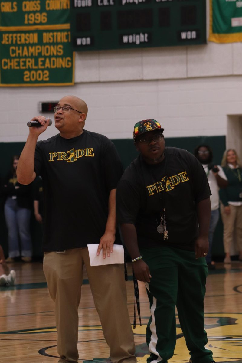 Principle Redd and Ban teacher Micah Lee sings and hype the crowd up before dismissal.
