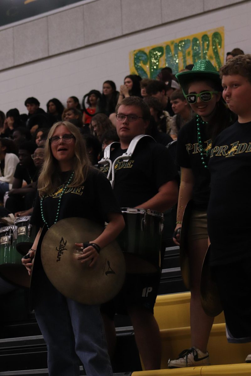 The band performs their departing song as the students are called for dismissal by section.
