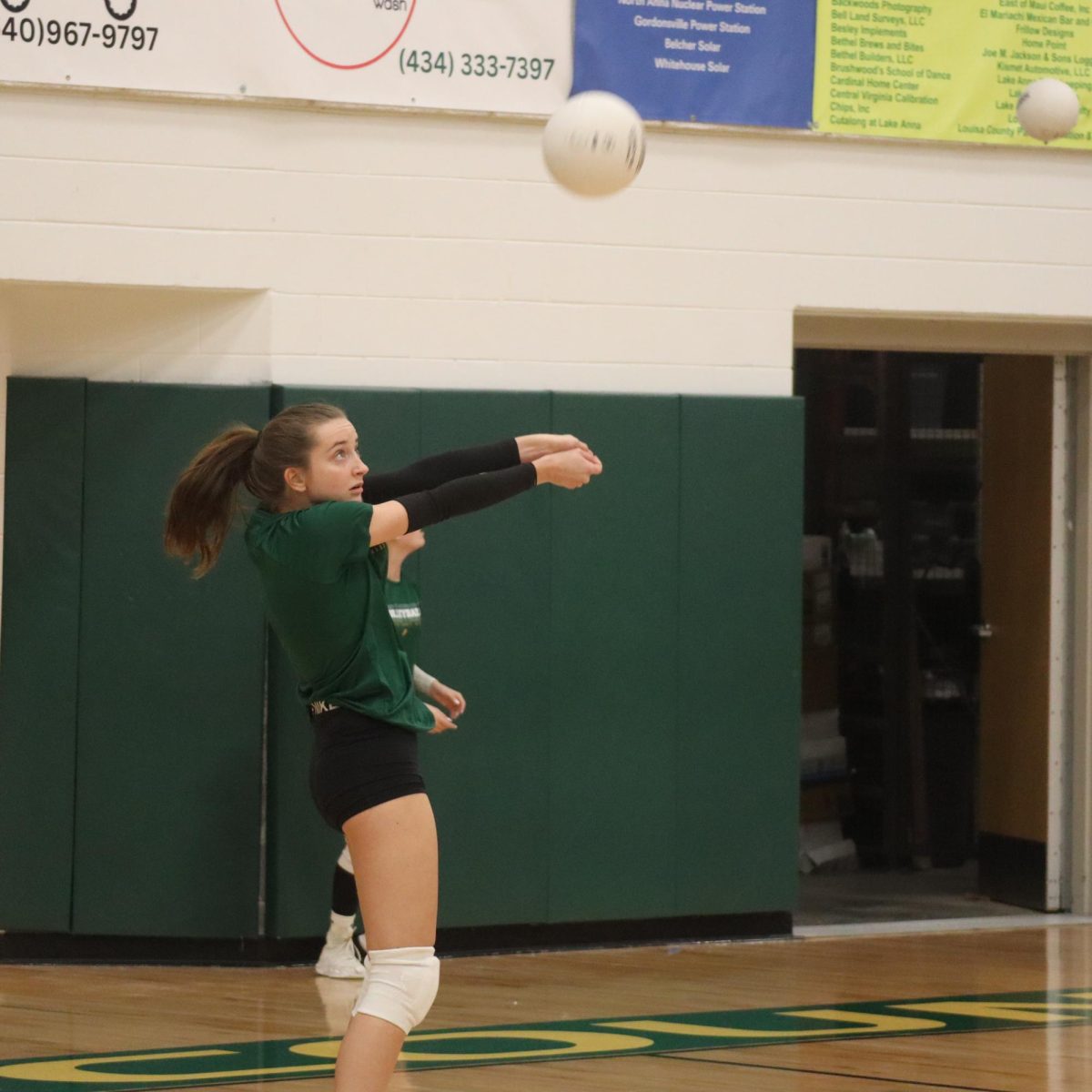 Sophomore Madison Gholson practices her bump passes.