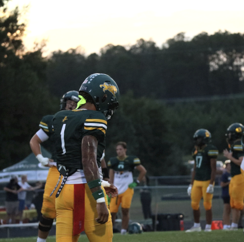 Rutgers commit, Dyzier Carter, runs a route in order to prepare for the game against Fluvanna. 

