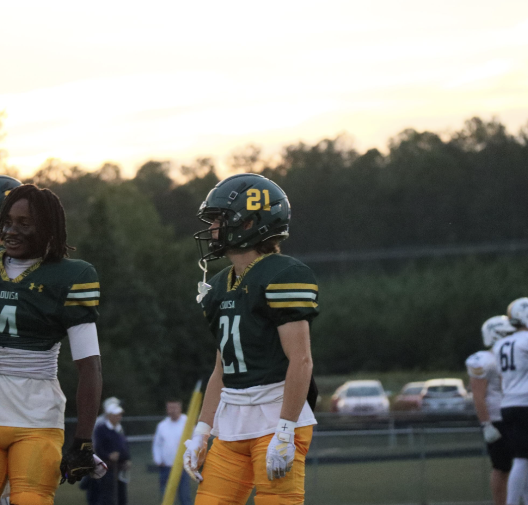 Junior Aldan Hepler prepares to run a warm up route, while the sun sets. 