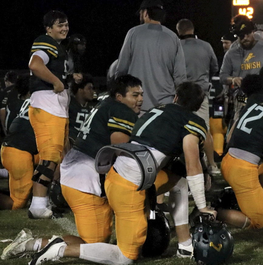 Senior Axel Franco and Wilson talk about the game during an injury timeout.
