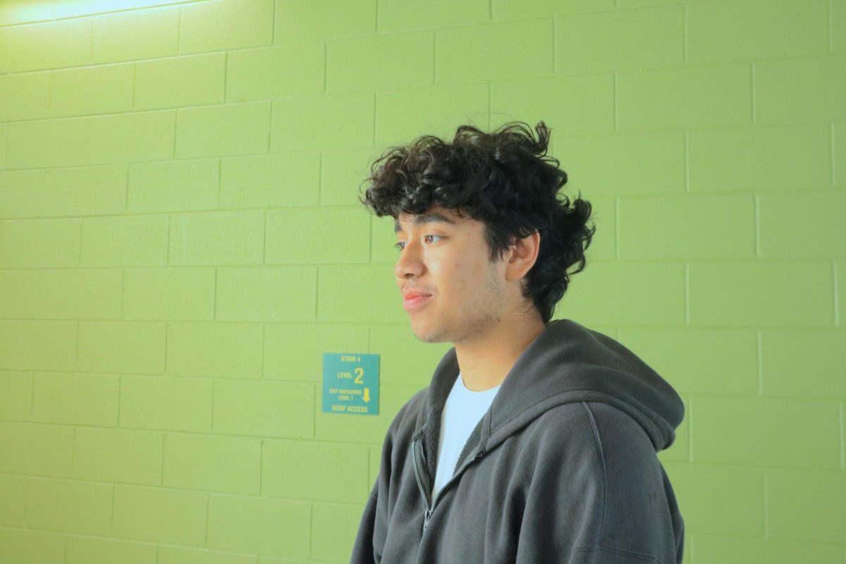 Junior Luis Rodriguez listens as he is asked when he first started watching the show.