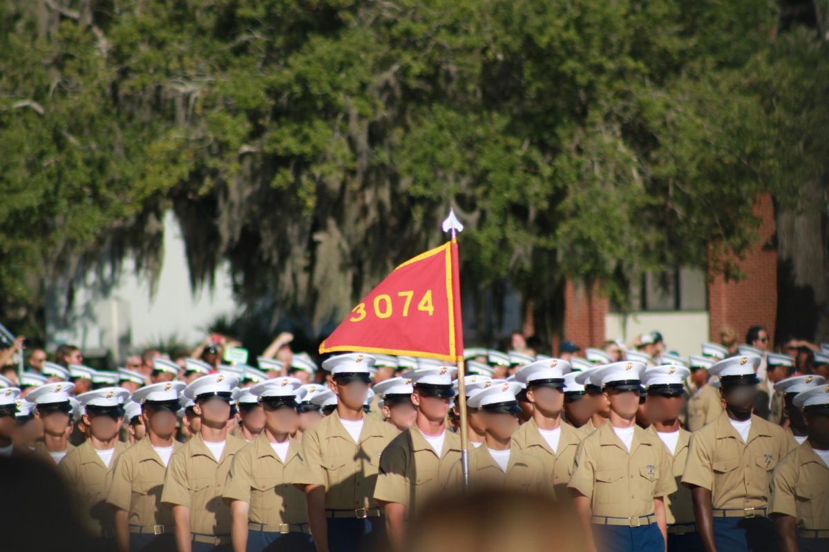 Platoon 3074 walking past their families in the bleachers at the beginning of the Graduation Ceremony. 