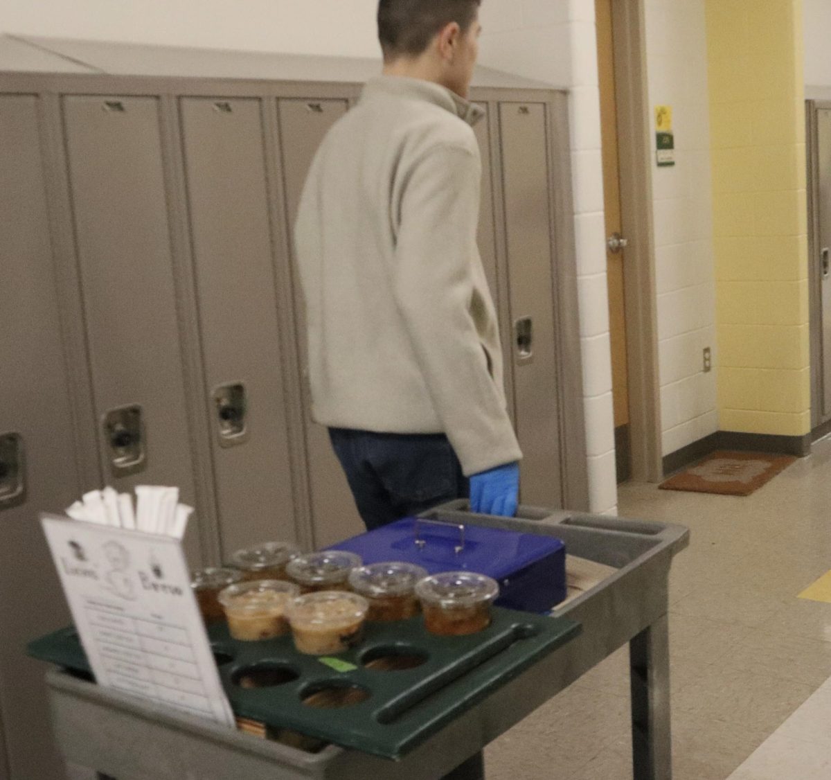  Swingle pushing the coffee cart to deliver coffee on the second floor.