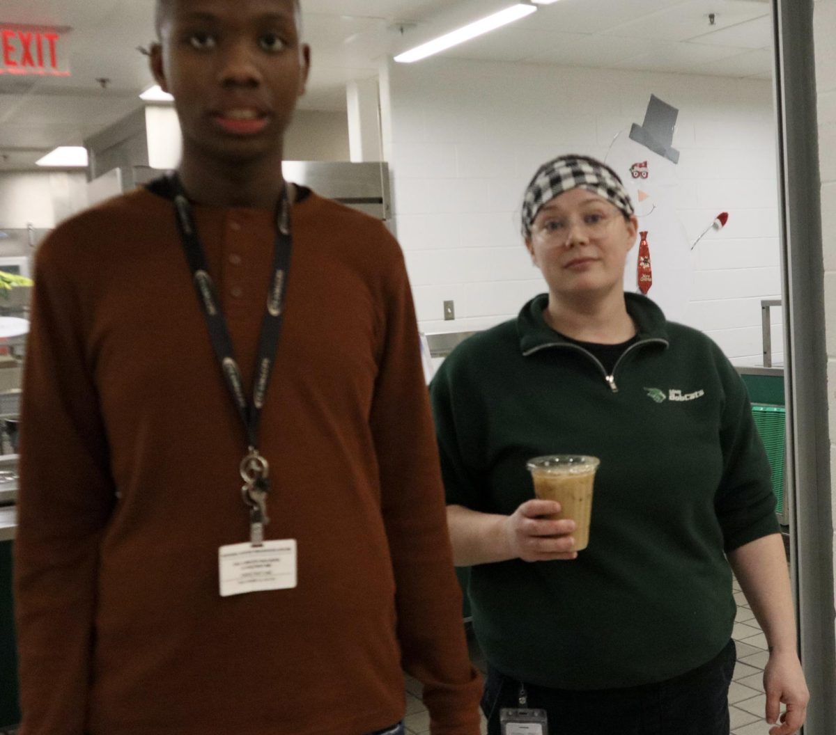 Young gives Ms. Parker her daily coffee.