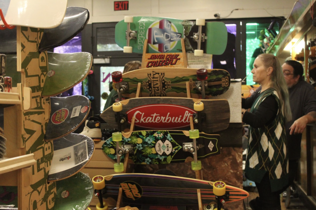 While at the front of the shop, Strangehouse advertises its variety of boards and other board accessories.