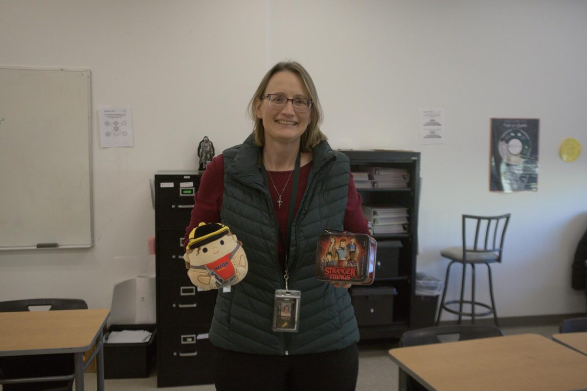 Math teacher Ms. Ott posing her Stranger Things merch. 