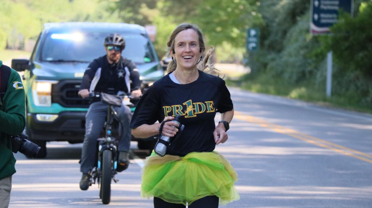 Ms. Fletcher makes her way to the finish line with a smile on her face.