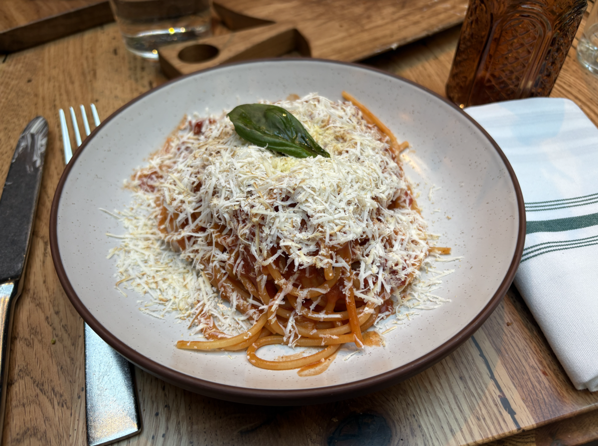 I ordered the Spaghetto al Pomodoro e Ricotta Affumicata, and it tasted how it looked: a delicious balance of smoky, creamy, and fresh flavors. Our starter was Terra's signature crispy sourdough bread with salted butter, which we finished almost immediately.
