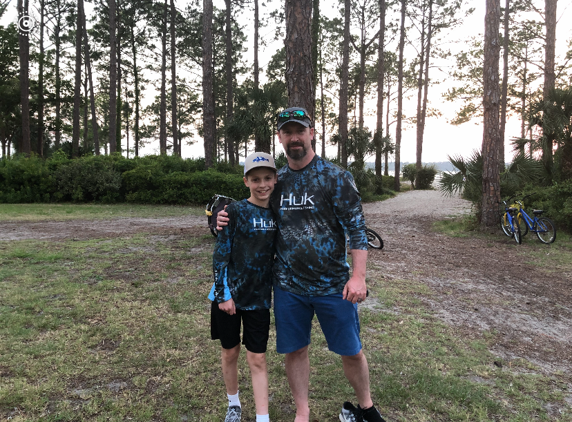 My father and I celebrate a family vacation before the start of 6th grade.