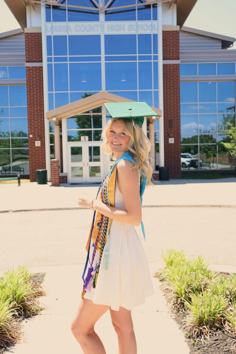 It starts to sink in that I am graduating as I take my cap and gown photos.
